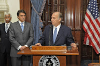 His Highness the Aga Khan addressing the media prior to the signing of the Memorandum of Understanding between the University of Texas and the Aga Khan University, as Governor Rick Perry of Texas listens intently.