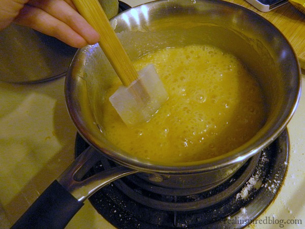 Easy Five Minute Holiday Fudge Recipe Cooking on the stove Show how thick and bubbly it is.