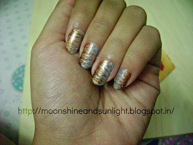 http://www.moonshineandsunlight.com/2013/07/metallic-marbled-nail-art-moonshine-and.html