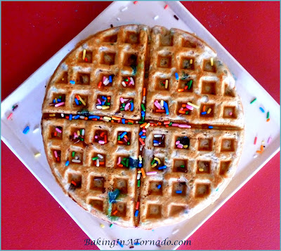 Springtime Waffles, the colors of spring add to the fun of these waffles with some surprise ingredients. For Easter or any occasion. | Recipe developed by www.BakingInATornado.com | #recipe #breakfast #Easter