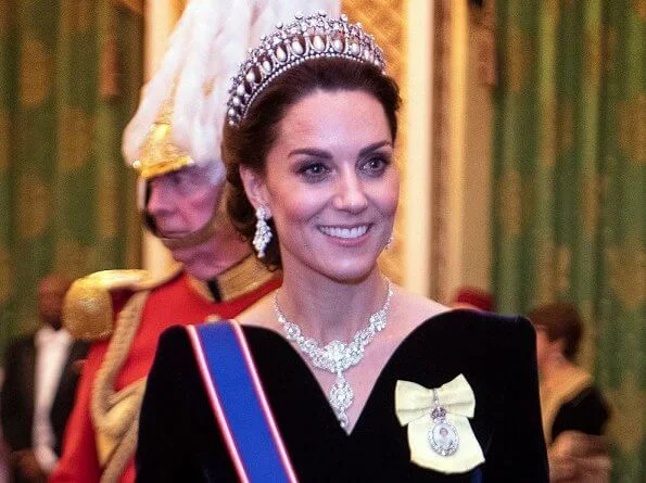 Kate Middleton wore a velvet Alexander McQueen gown, the Lover's Knot tiara, the Nizam of Hyderabad necklace