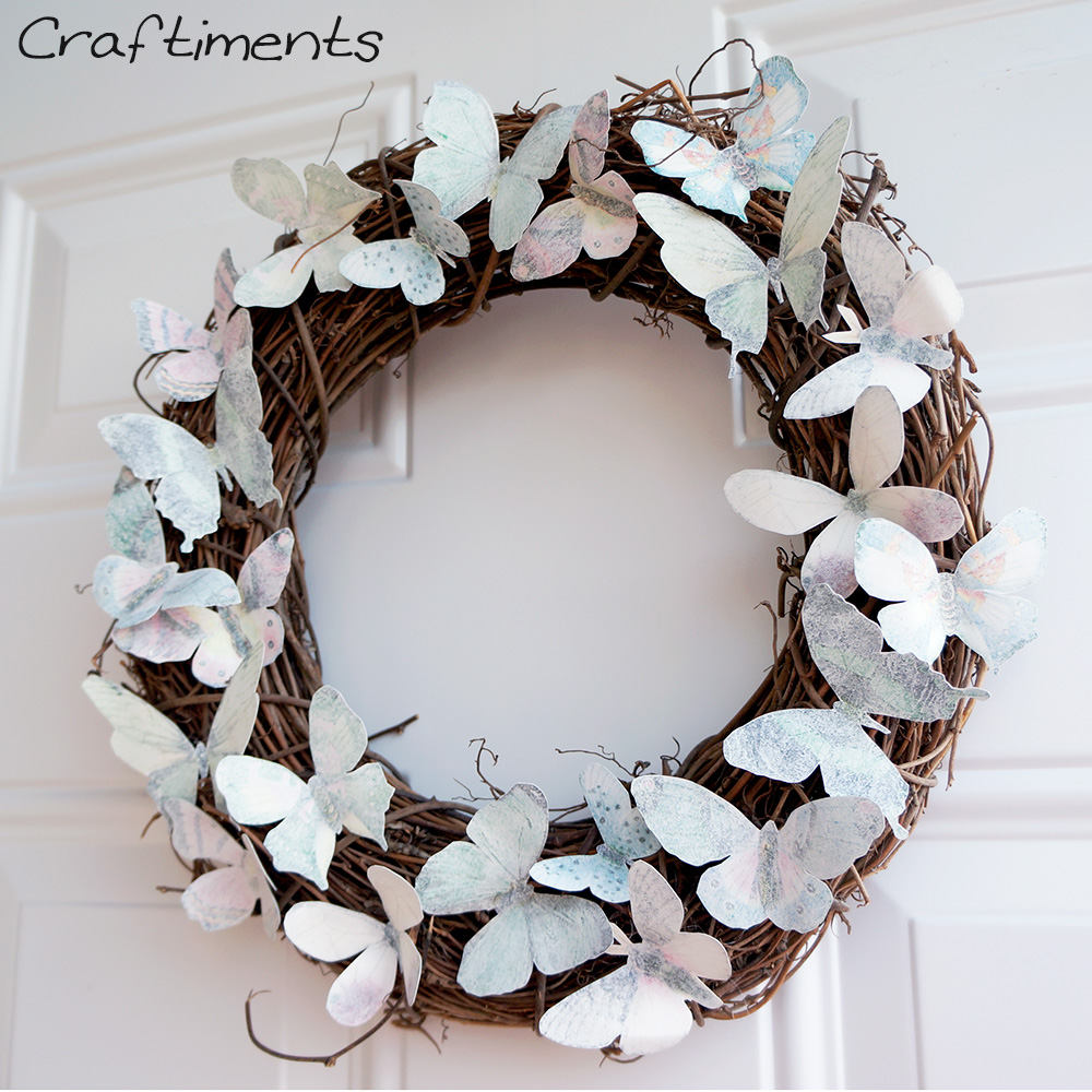 Paper butterflies glued to a grapevine wreath