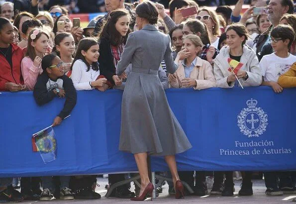 Queen Letizia wore grey coat dress, Crown Princess Leonor wore a Mango pattern jacket and Infanta Sofía wore a coral Mango dress