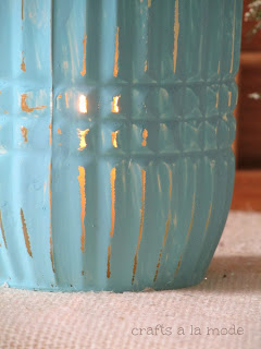 blue painted vase with candle