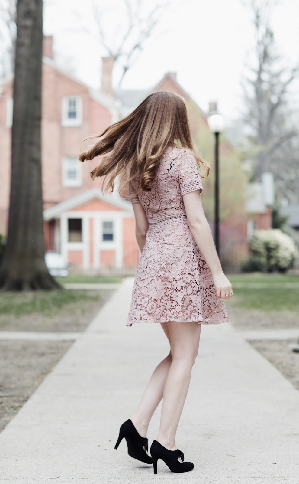 black dress with blush heels