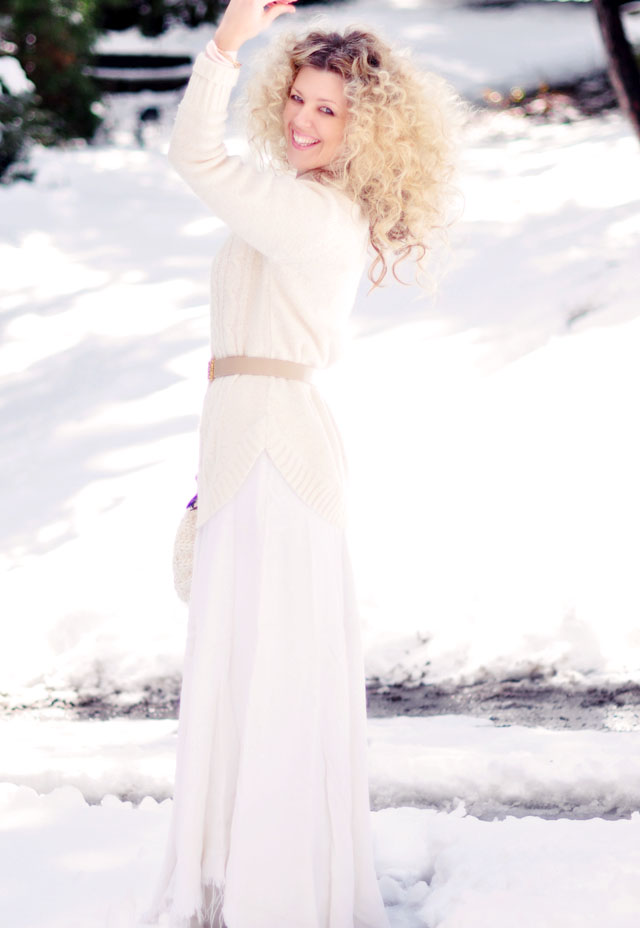 big blonde afro curls, light neutrals in the snow, winter style