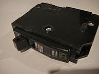 "Square D 20-Amp Single-Pole Breaker (1)" by CyberXRef via Wikimedia Commons