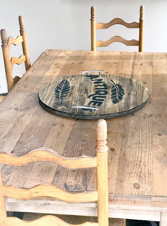 Wooden stenciled tray on table with 3 chairs
