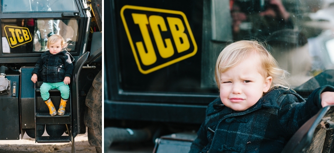 adorable little boy at the farm on a JCB tractor photo by STUDIO 1208