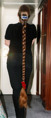 Rapunzel very long braid beautiful woman with floor length hair