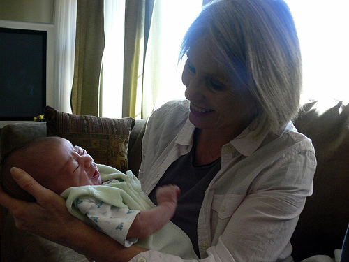 Image: In grandma Julia's arms - 13 days old, by Jessica Merz, on Flickr