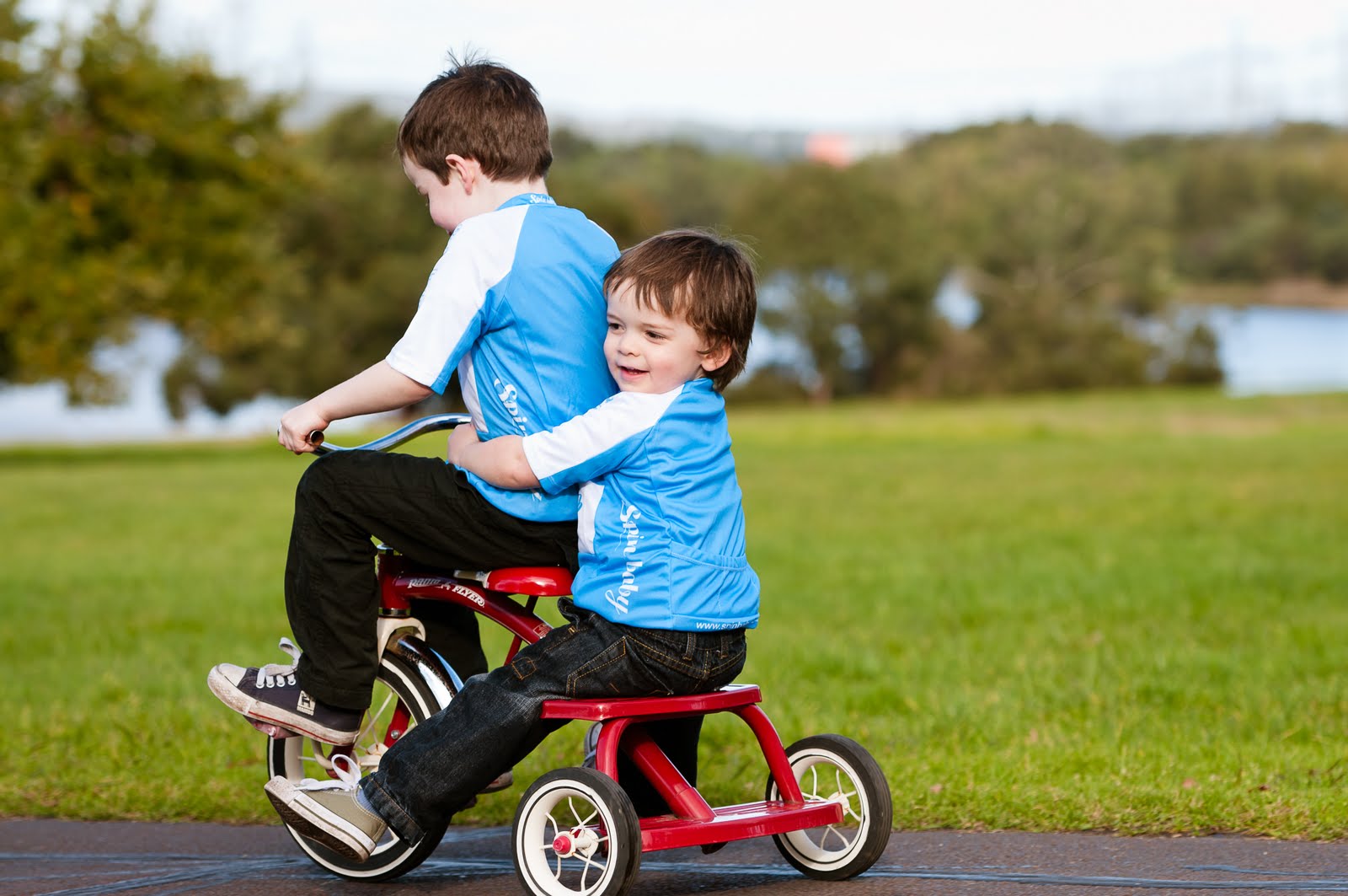 Spinning babies. Kid Wear Stroller. Cycle Baby Mini Seat. Boy feel Bike with mom.
