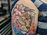 Forearm Lion And Rose Tattoo Meaning