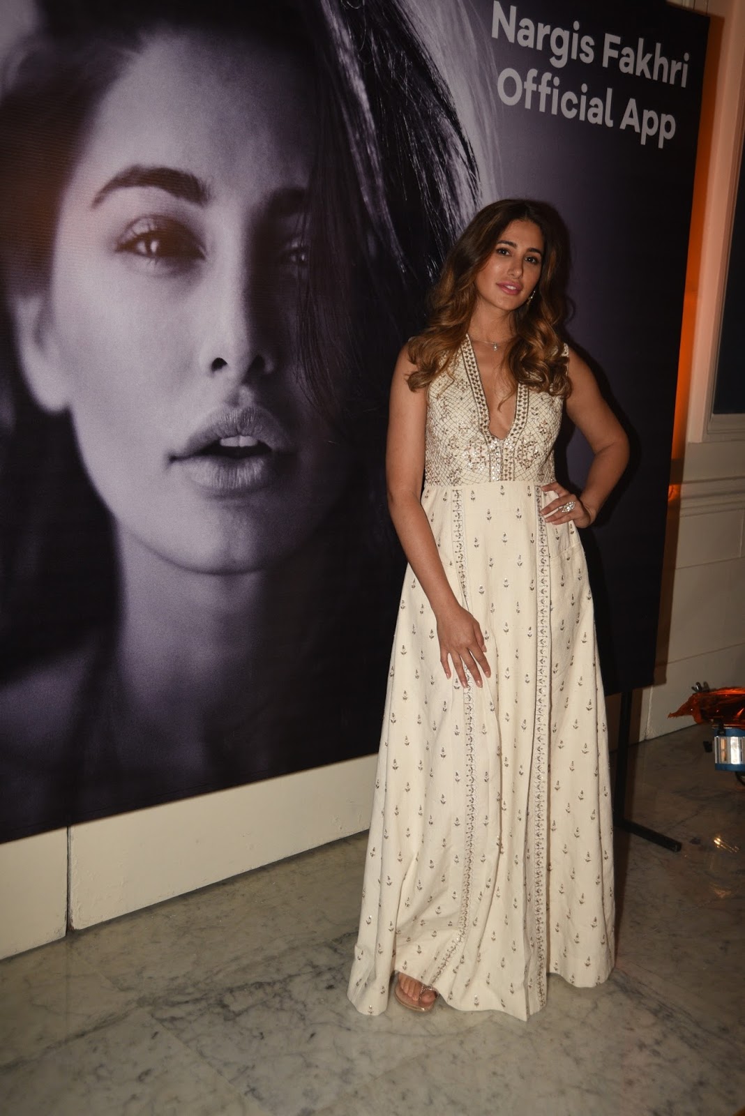 Nargis Fakhri Looks Hot in a White Dress At The Launch Event of Her Own App in Mumbai