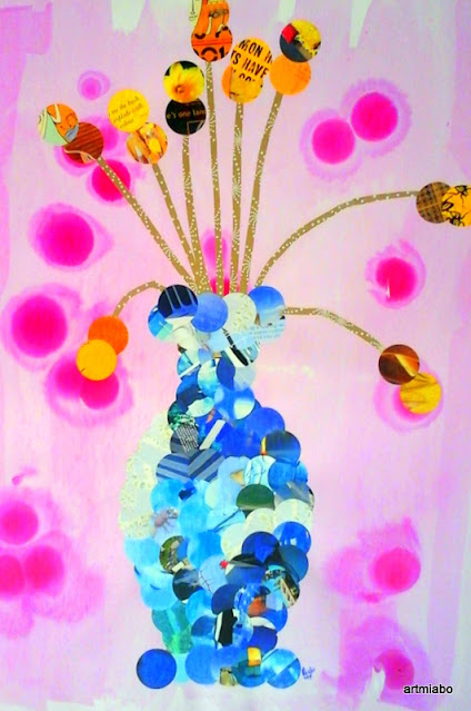 Flowers in a vase with old magazine cut out,with a paper cutter.     by miabo enyadike