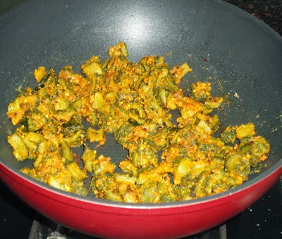 sprinkle besan and saute - preparing  karlaychi peeth perun bhaji recipe