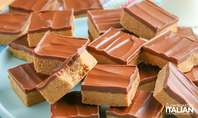 peanut butter bars stacked on a plate