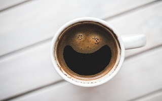 Tazzina di caffè con sorriso