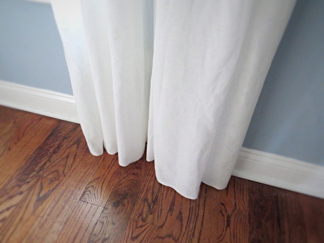 the bottom of the curtains at the floor after adding a pocket at top