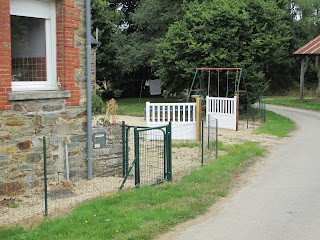 Side view of new gates to the gravelled courtyard