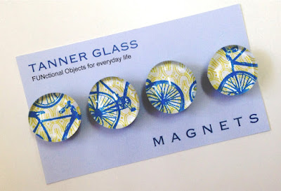 4 magnets, in blue and yellow, with bicycle designs