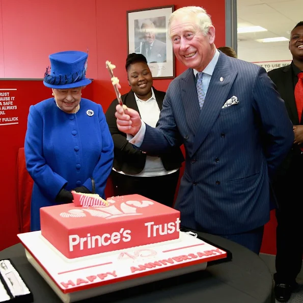 Queen Elizabeth II and Prince Charles, Prince of Wales visit the Prince's Trust Centre in Kennington
