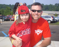 Chloe with Major League Baseball Star Sean Casey at the opening of the New Miracle League Field