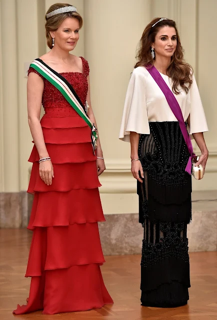 Queen Mathilde and Queen Rania attends a gala dinner at the Laeken royal Palace in Brussels. Queen Rania wore Valentino Gown, Queen Mathilde wore red gown. Queen Mathilde Tiara, Queen Rania diamond tiara