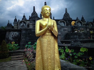 Golden Standing Buddha Statue In Front Of Buddhist Temple At Buddhist Monastery In Bali Indonesia