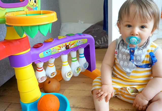 baby sitting next to little tikes light 'n' go 3-in-1 sports zone