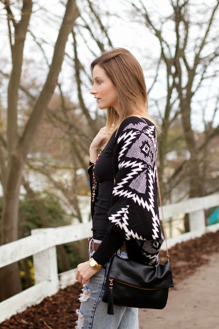 Vancouver Fashion Blogger, Alison Hutchinson, is wearing a Chicnova geometyric sweater, american apparel top, one teaspoon awesome baggies, zara western inspired boots, michael kors slim runway watch, and antropologie necklace and bracelets
