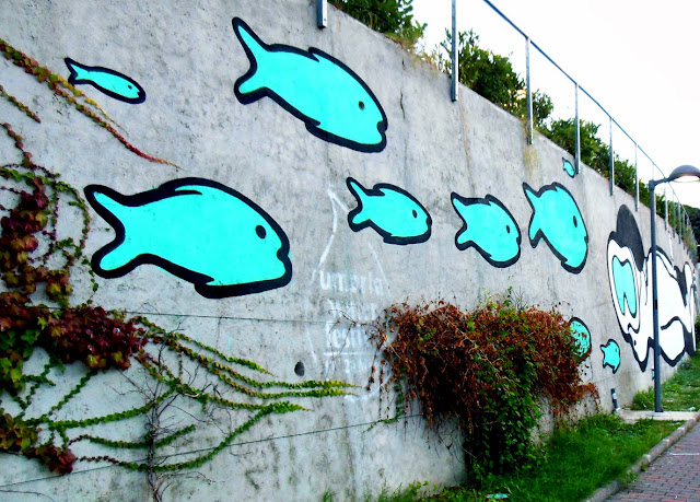 Italian Street Artist MP5 Paints a new mural entitled "Playing Upstream" in Terni, Italy. 5