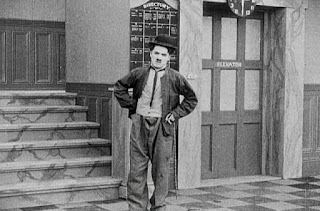 Кадр из фильма Чарли Чаплина The New Janitor (1914) - 9