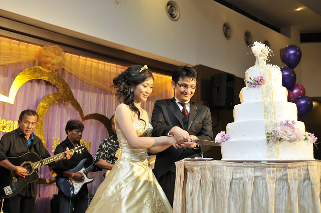 dummy cake band playing guitar at background