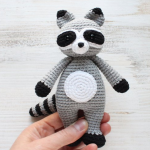 https://amigurumi.today/crochet-cuddle-me-raccoon-amigurumi-pattern/