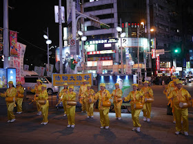 Falun Gong adherents playing drums at Ximending in Taipei