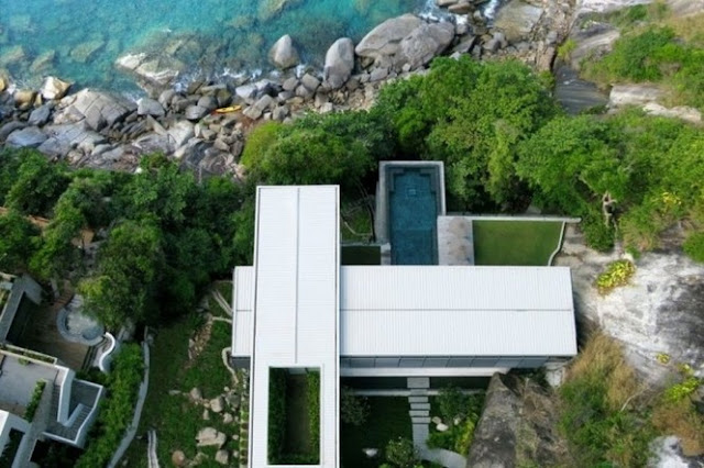 Photo of an amazing home as seen from the air right above the house