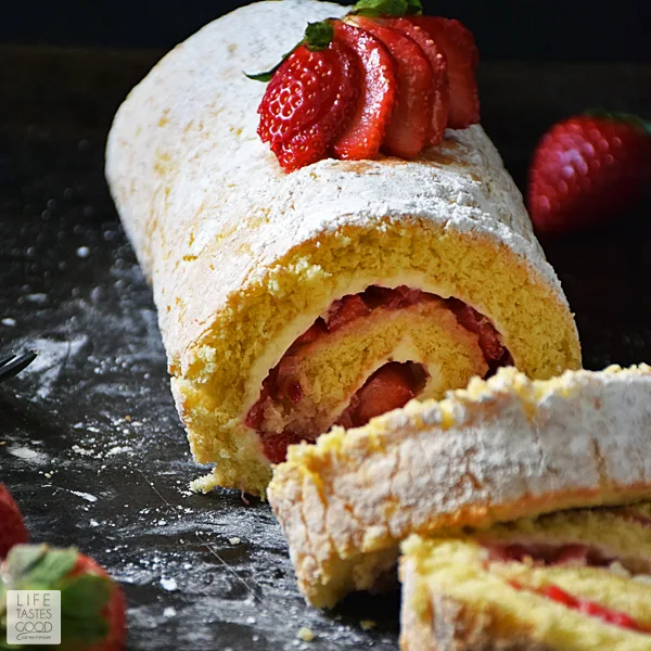 Strawberry Jelly Roll Cake | by Life Tastes Good just in time for Valentine's Day! You already make their heart go pitter patter, so why not treat their taste buds to this rich, delicious cake with fresh Florida strawberries all rolled up into a pretty package. #LTGrecipes