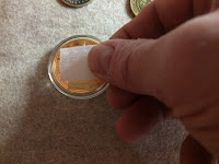 Adhering the Velcro to a coin