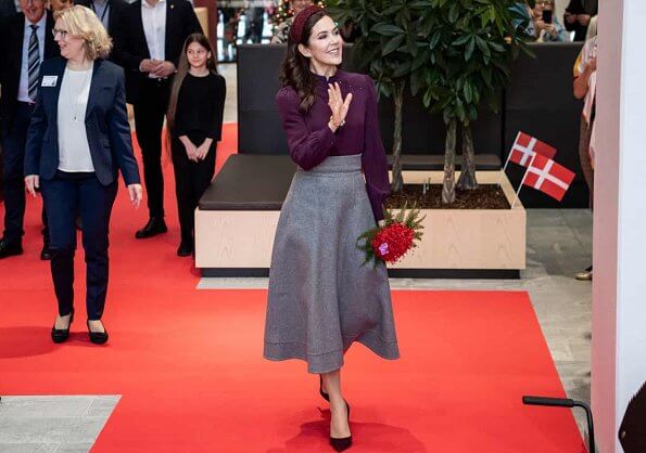 Crown Princess Mary attended the opening of Viborg Regional Hospital's new emergency center. burgundy blouse, grey midi dkirt, grey wool coat