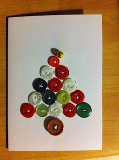 Homemade christmas card made with coloured recycled buttons sewn onto card