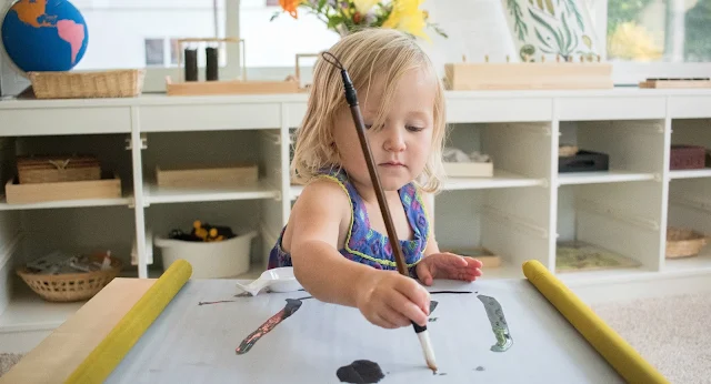 Observing artistic expression with a Buddha Zen Scroll. As a Montessori parent, it's important to take time to observe your child. This mess free painting set makes that easy. 