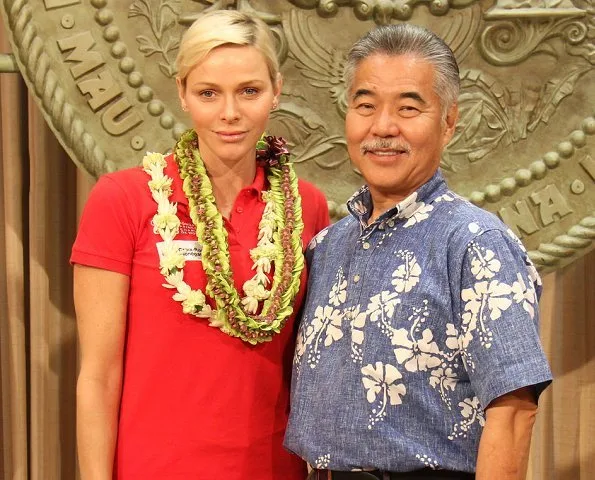 Princess Charlene of Monaco visited Honolulu, Hawaii met Governor David Idge. She wore red shirt and white pants