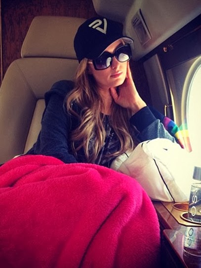 The Paris Hilton Poses in Private Plane in Square Sunglasses