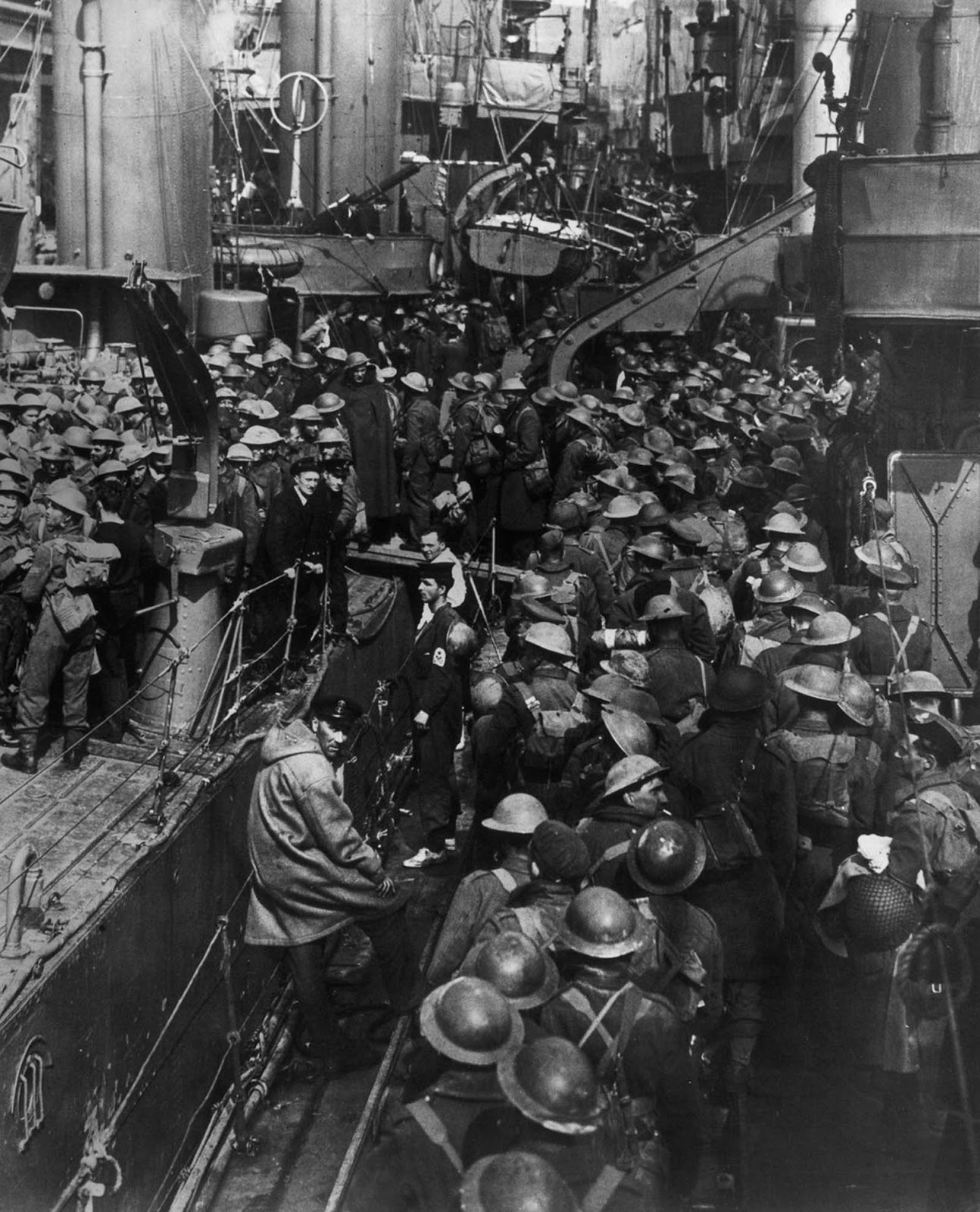 Allied troops crowd aboard ships during the evacuation of Dunkirk.