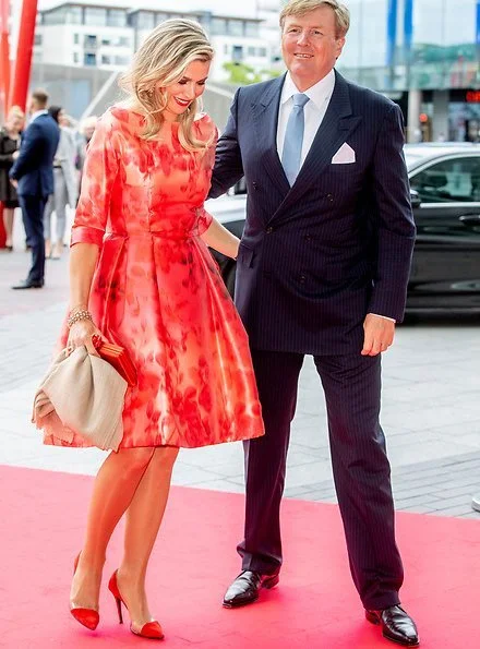Queen Maxima's outfit is from the fashion house Natan floral print dress. President Michael Higgins and Sabina Higgins