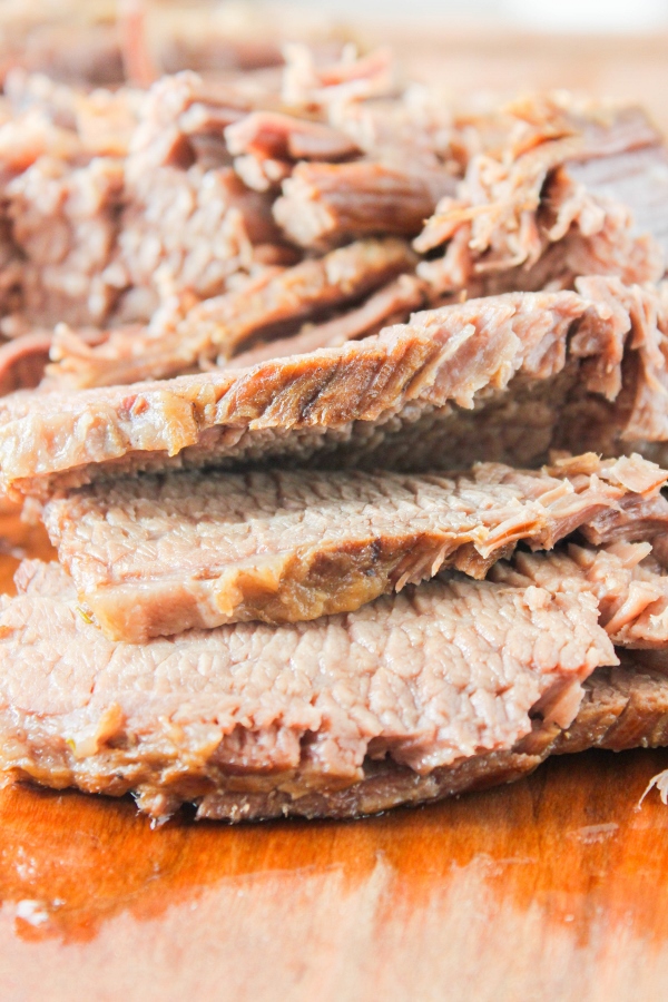Beautiful beef brisket gets braised until tender in an easy sauce with beer, mushrooms, and onions. The meat is sliced and piled high on toasted bread to make delicious sandwiches that the whole family will love!