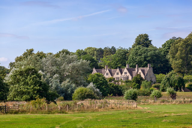 Looking across the Cotswolds countryside to Asthall Manor by Martyn Ferry Photography