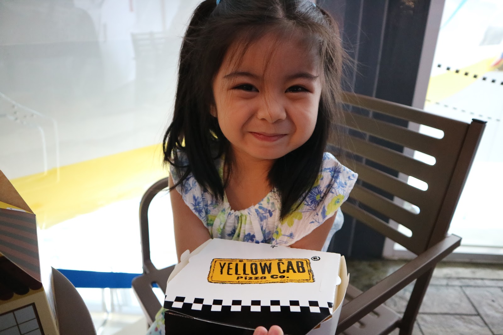 Chloe and her Yellow Cab pizza