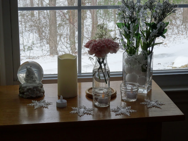 Plastic snowflakes, flowers, snowglobes and flameless candles.